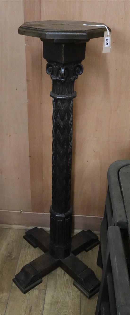 A Victorian carved oak torchere H.128cm